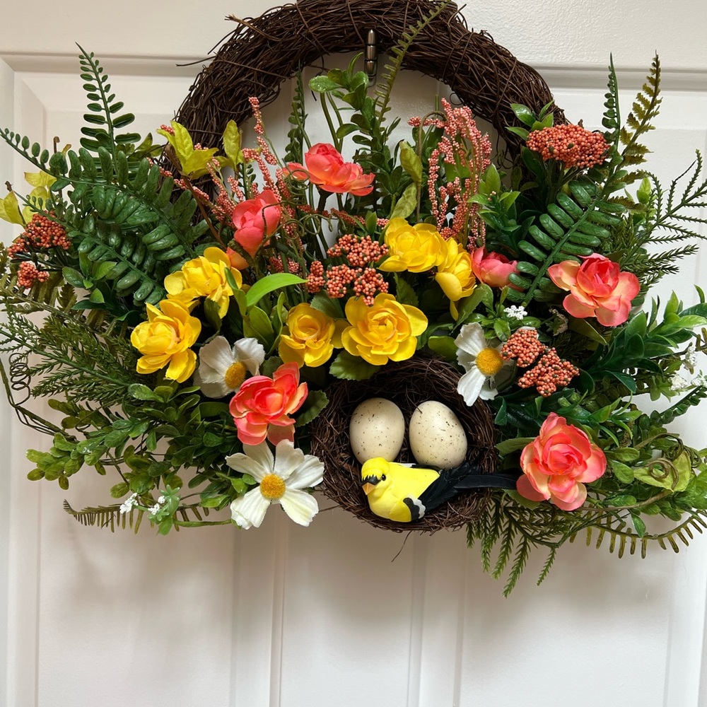 Vibrant Floral Wreath with Bird and Eggs